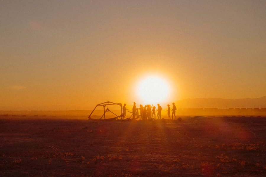 A Holi celebration captured at sunset on the Mars campus.